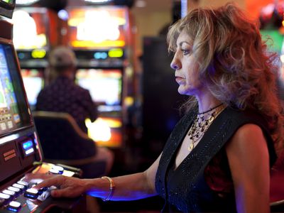 Woman using slot machine