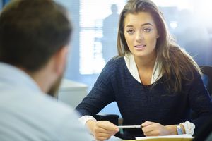 young office intern chatting to a colleague