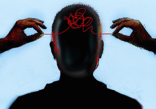 hands untangling threads in man's head