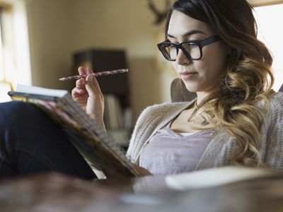 Woman Writing in Notebook