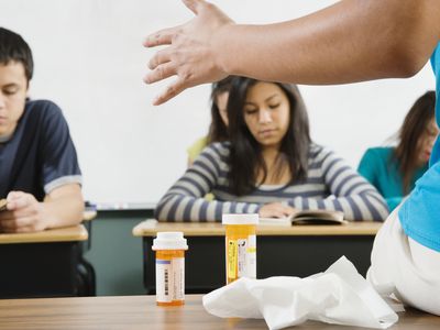 Prescription Medicine Bottles on a Teacher's Desk