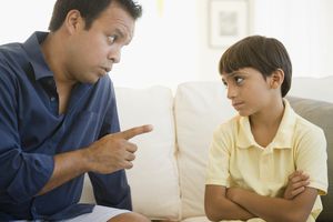 Father lecturing misbehaved son