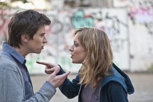 Young couple arguing in street
