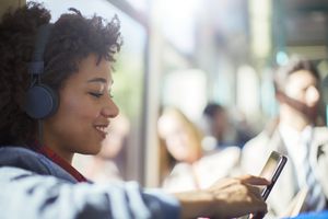 Woman listening to music on the bus