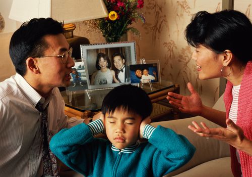 CHINESE MAN & WIFE ARGUING IN FRONT OF CHILD