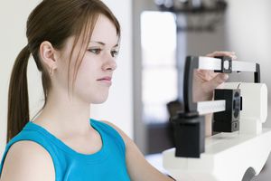 Disappointed Girl on Scale