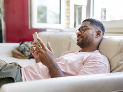 Man texting family on his phone