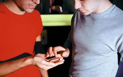 Male hand holding recreational drugs