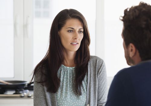 Serious woman talking to a man