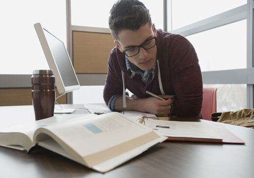 College student studying at computer