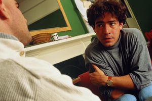 Two men talking during couselling session, close-up