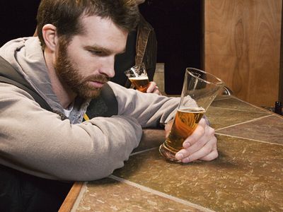 Man in bar with a beer