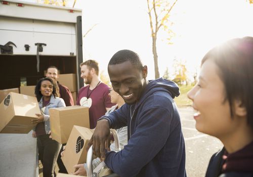 Volunteers helping unload truck