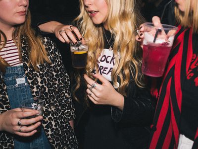 young women drinking together