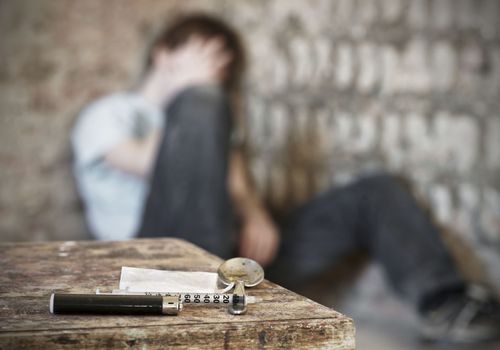 Young man with drug paraphernalia