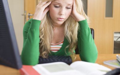 A teenage girl studying