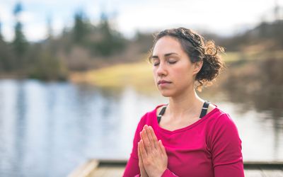 Woman meditating outside