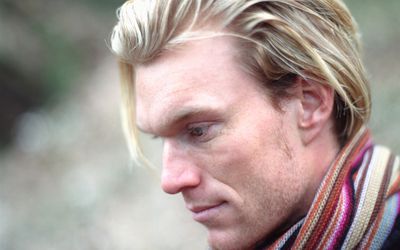 Reflective young man looking down, portrait