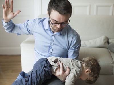 Father disciplining toddler