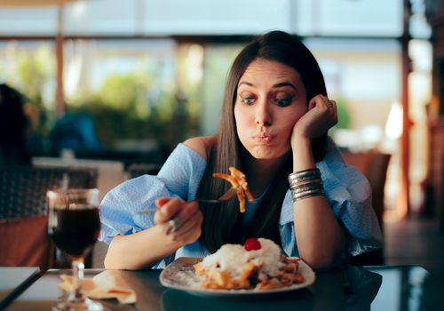 Woman Feeling Sick While Eating Huge Meal