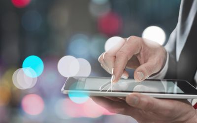 Businessman using digital tablet, close up