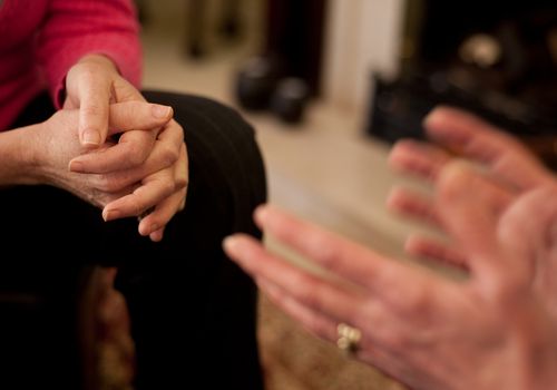 Therapist talking with patient