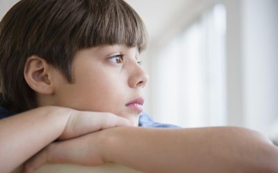 USA, New Jersey, Jersey City, Portrait of pensive boy (8-9)