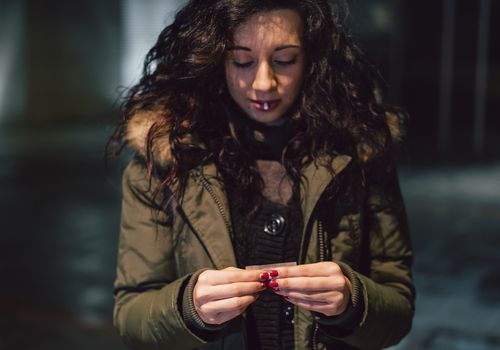 Woman rolling a joint