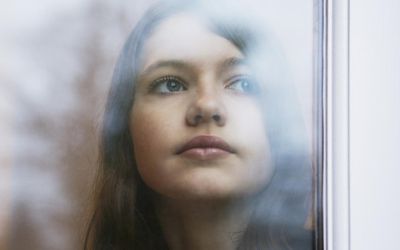 Girl looking out window