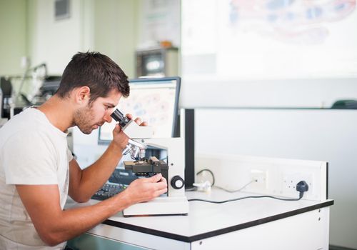 Medical students with microscopes