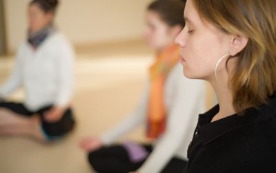 Group class sitting and meditating