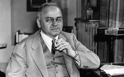 Alfred Adler sitting in his office