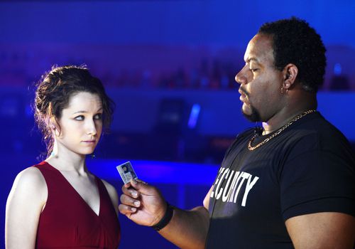 Bouncer Checking Girl's ID”class=