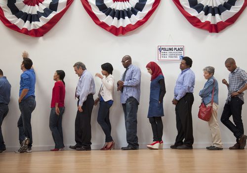 Voters waiting to vote in polling place