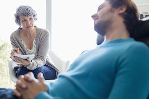 A psychologist talking to a client