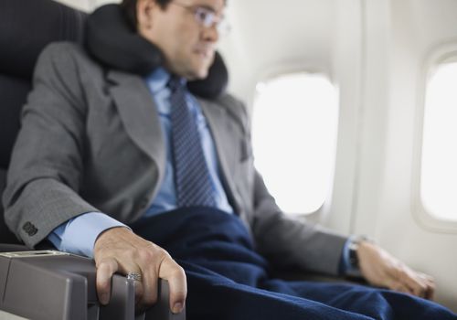 Nervous passenger sitting on airplane