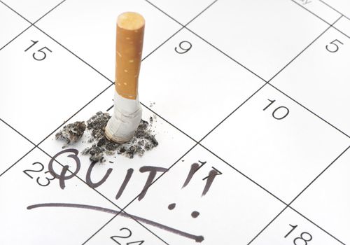 Quit date and cigarette butt on a calendar