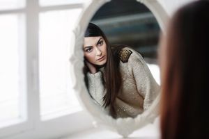 Woman looking in the mirror