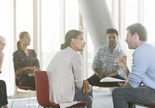 People sitting in a circle talking