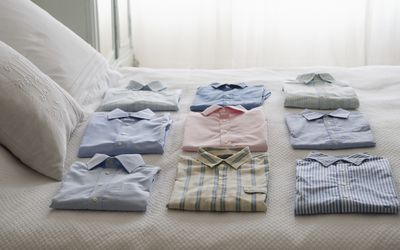 Clean shirts ordered on a bed