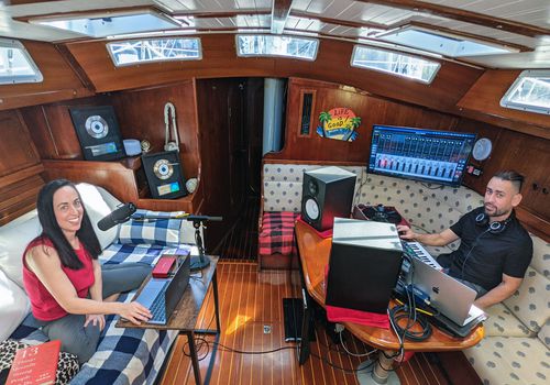 Amy Morin and Nick Valentin record The Verywell Mind Podcast from a sailboat in the Florida Keys