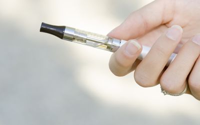 Hand holding an electronic cigarette