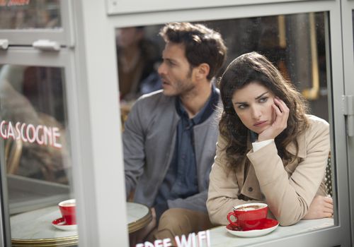 Bored couple in a cafe