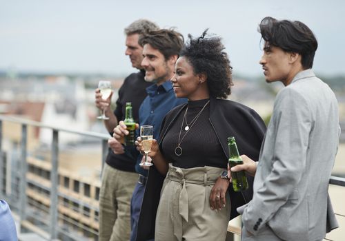 Corporate co-workers having drinks after meeting