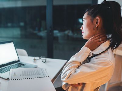 woman working looking stressed