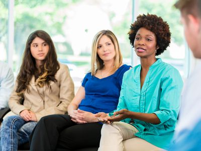 African American woman speaking during group therapy