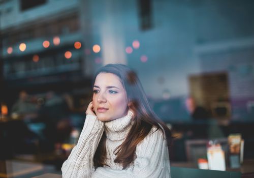 Lonely girl in cafe