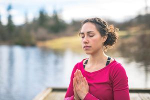 Woman meditating outside