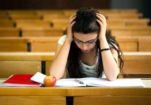 Stressed out student taking exam