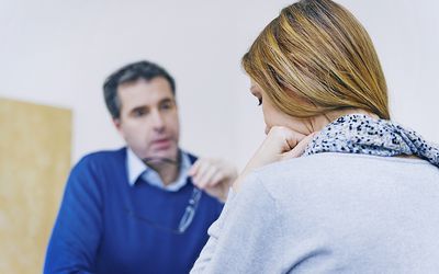 Woman In Consultation with Doctor